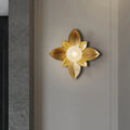 Modernist gold flower light fixture metallic wall sconce with glowing central light for bedroom use