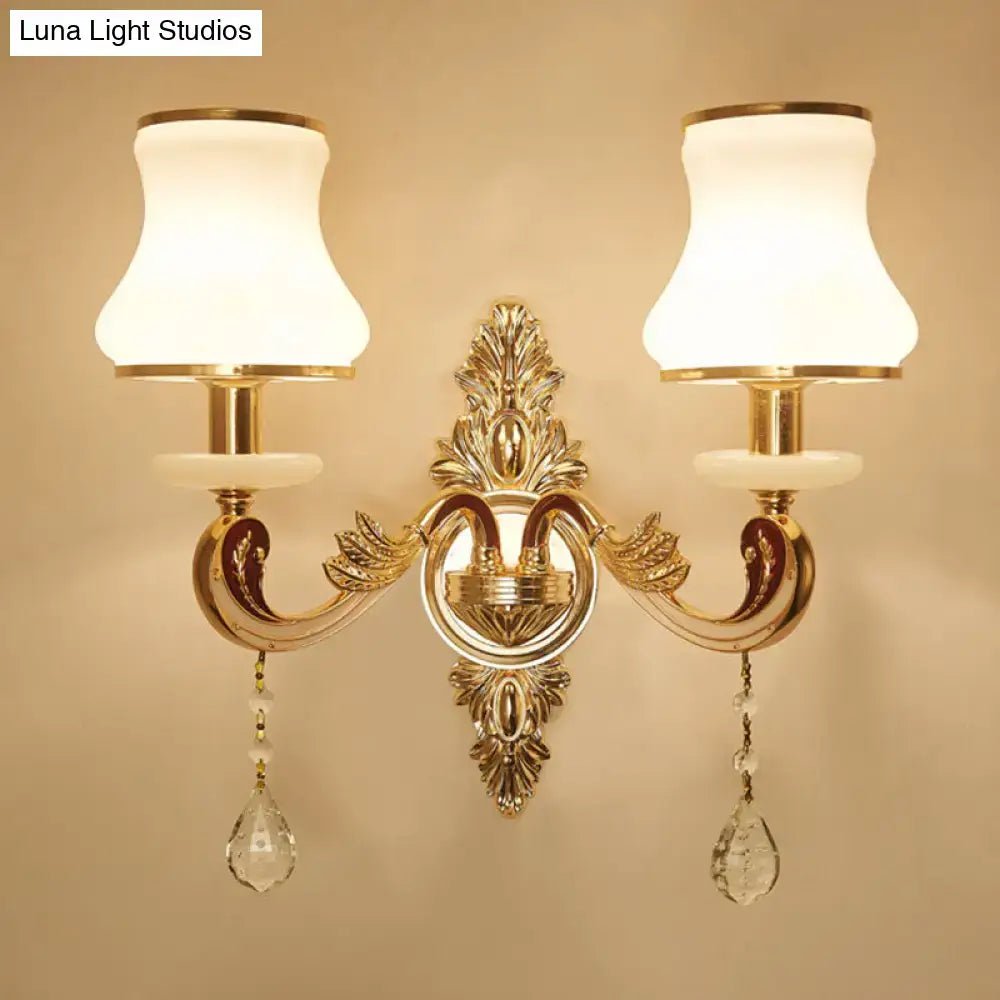Modernist gold wall sconce with glass shade living room light