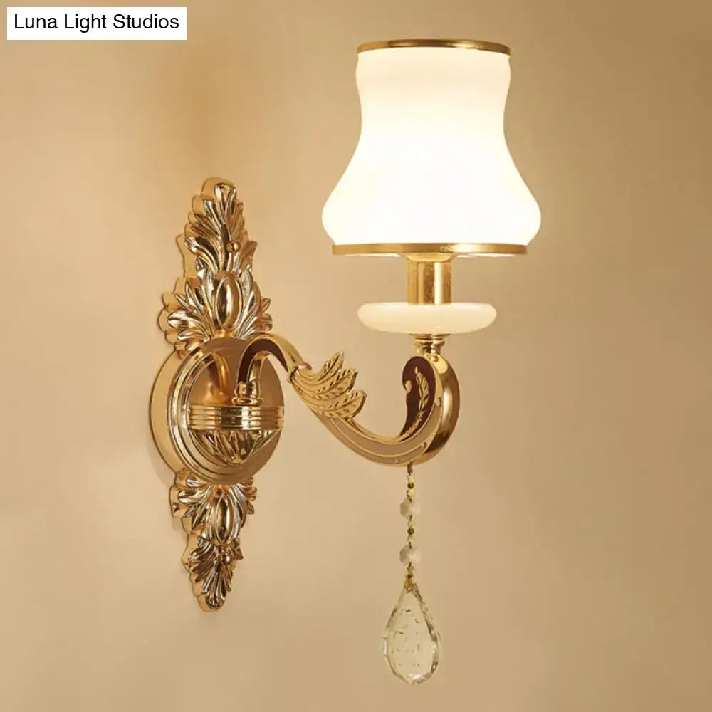 Modernist gold wall sconce with glass shade living room light