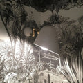 A modernist off-white conical wall mounted sconce with gold finished arm and rotating node for wide flare bedroom light