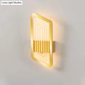 Gold-finished Nordic wall light fixture with illuminated concentric neon lines and vertical slats for living room use