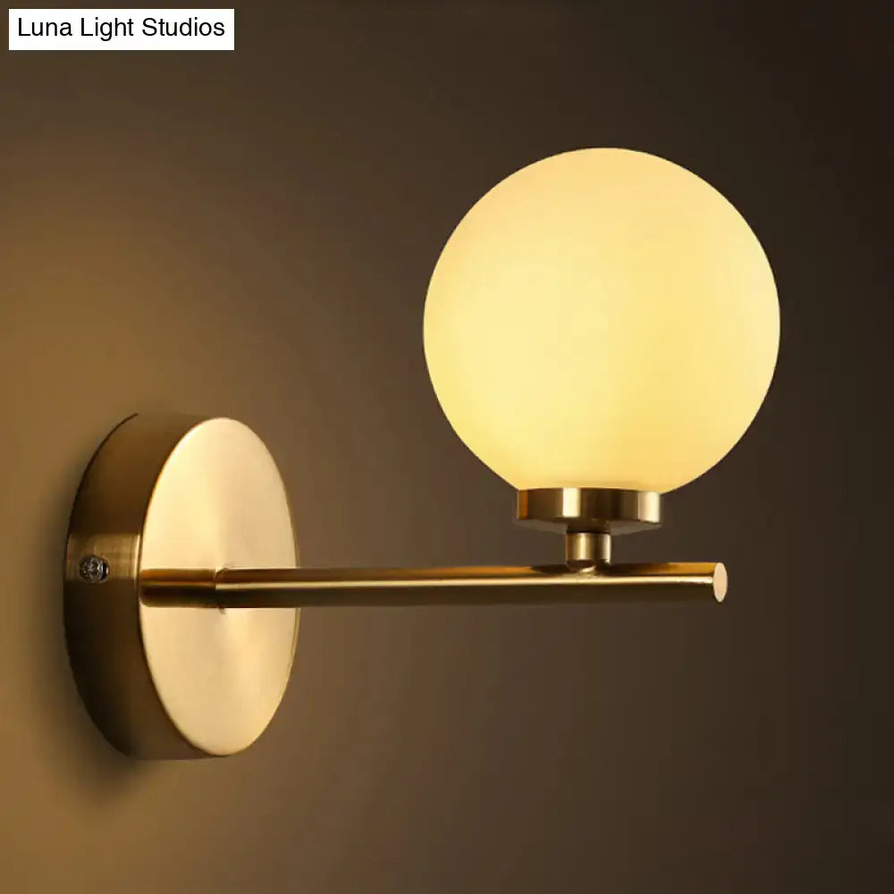 Nordic brass wall sconce light with glass globe – bedroom lighting