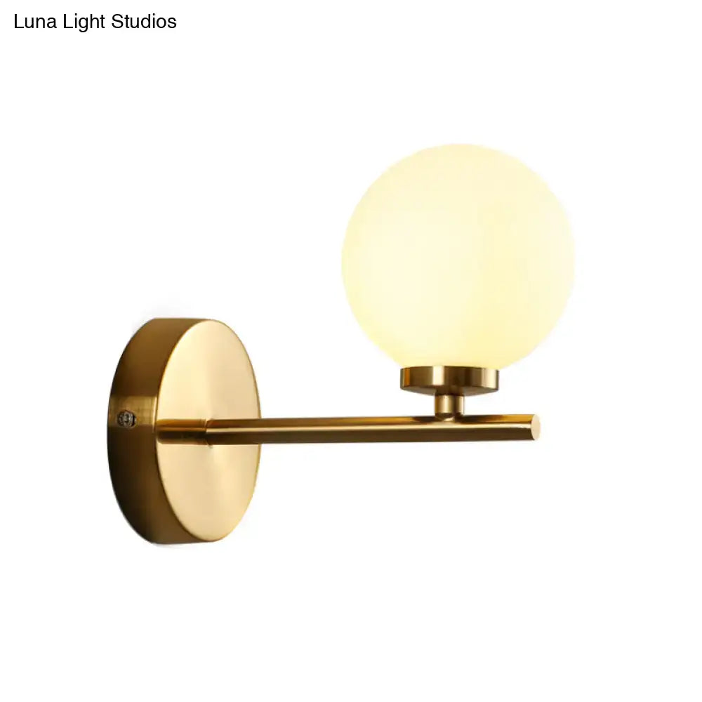 Nordic brass wall sconce light with glass globe – bedroom lighting