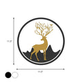 Circular wall decal featuring a gold deer with antlers adorned with birds, set against black mountain silhouettes within a white circle framed by a thick black border.