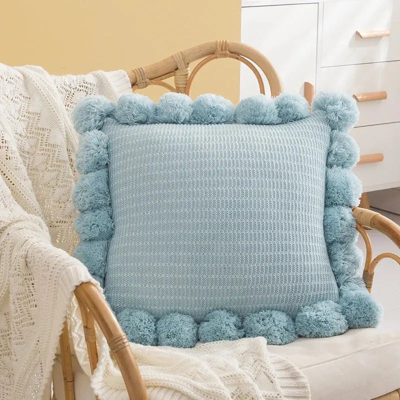 Orange textured ball cushion cover with pompoms living room decor