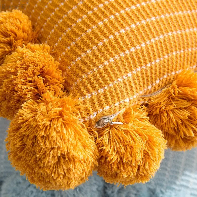 Orange textured ball cushion cover with pompoms living room decor