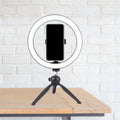 Portable black and white led ring light with phone mounted on compact tripod for 110v-120v and 220v-240v use