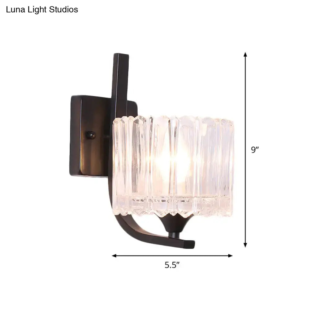Post-modern black metal wall sconce with clear crystal shade bedroom
