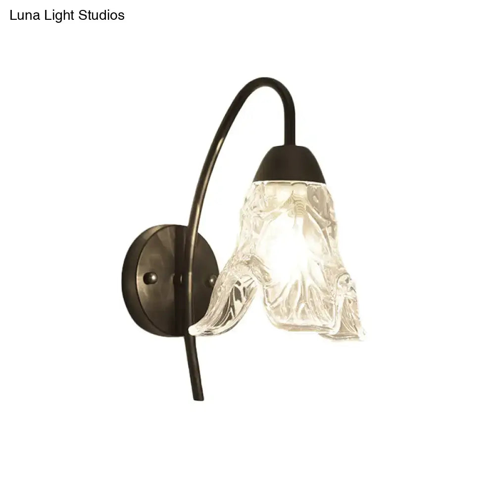 Post-modern black metal wall sconce with clear crystal shade bedroom