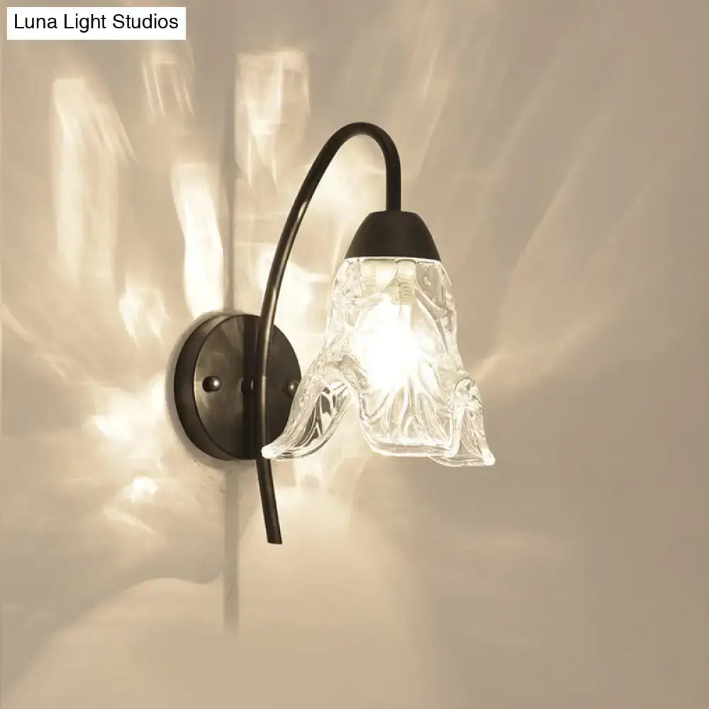 Post-modern black metal wall sconce with clear crystal shade bedroom