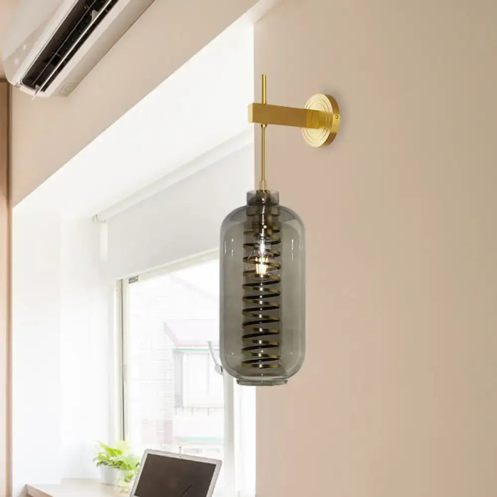 Post-modern brass and smoke gray glass cylinder sconce – bedroom light