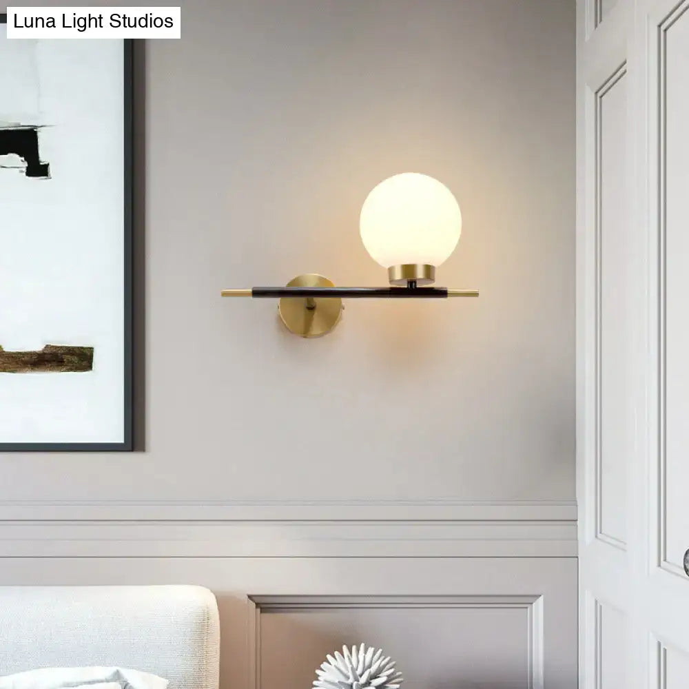 Post-modern white and brass sphere wall sconce bedroom light