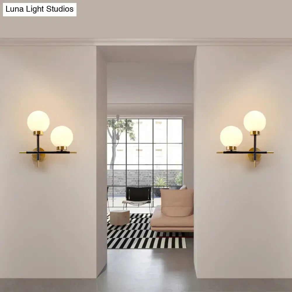 Post-modern white and brass sphere wall sconce bedroom light