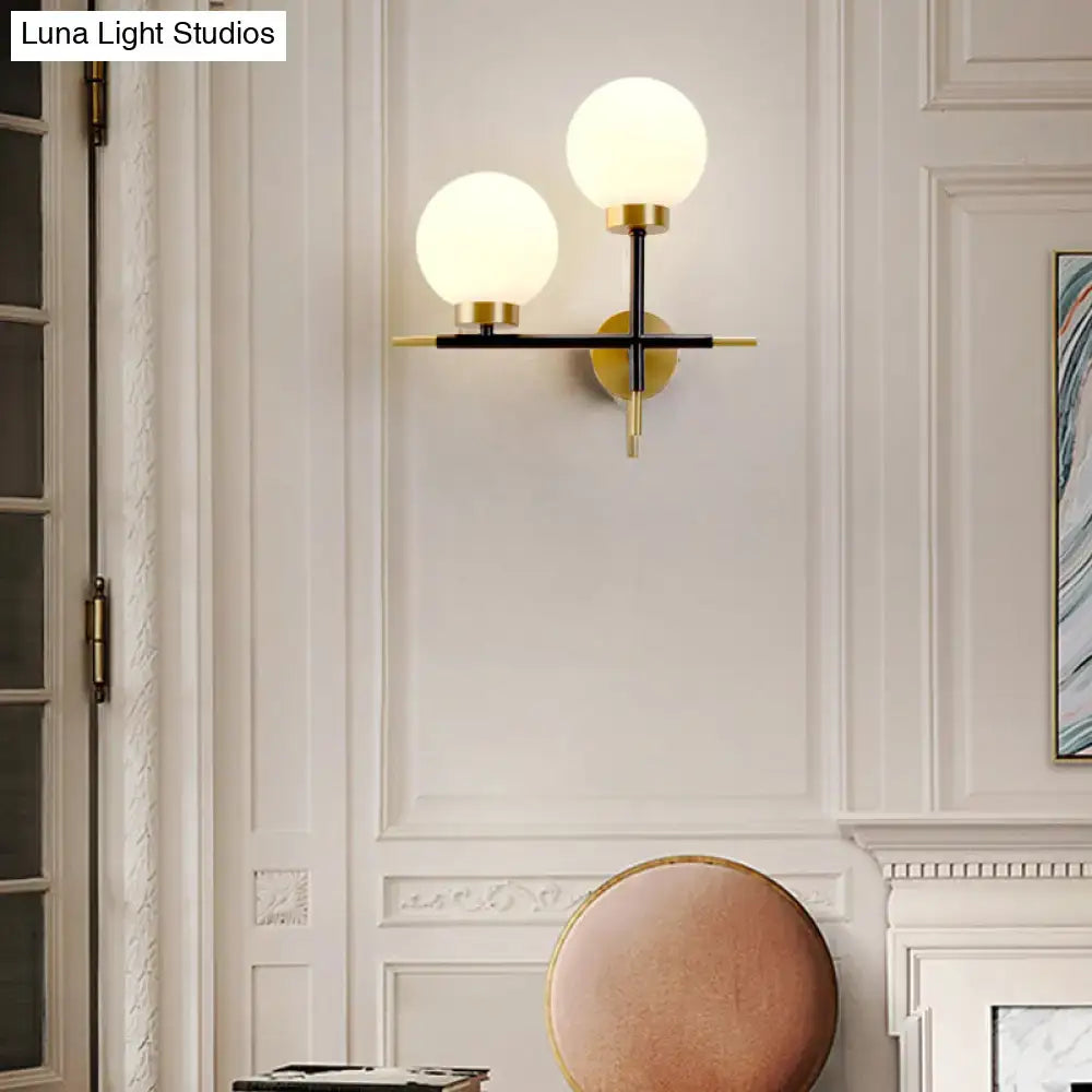 Post-modern white and brass sphere wall sconce bedroom light