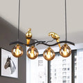 Postmodern black & gold bird pendant light with amber ball glass shade