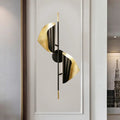 Postmodern black and gold ribbed leaf wall light with sleek metallic finish designed for staircase illumination