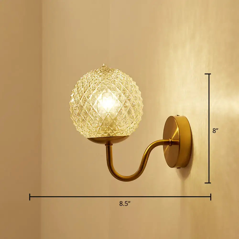 Postmodern gold ball shaped wall sconce with textured glass shade bedroom light