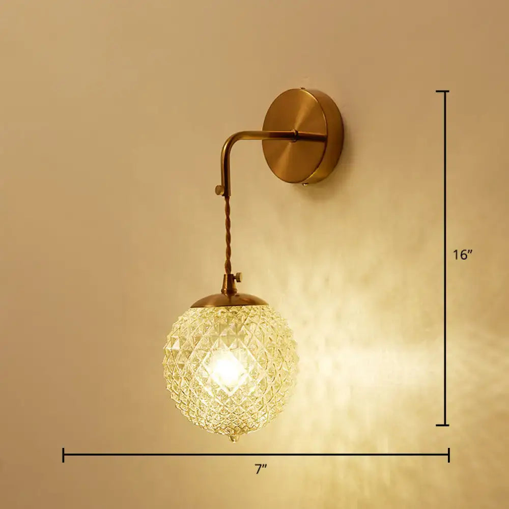 Postmodern gold ball shaped wall sconce with textured glass shade bedroom light