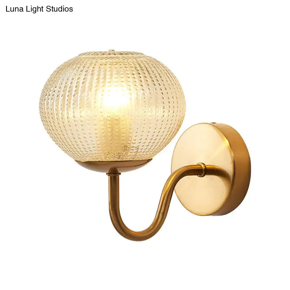 Postmodern gold ball shaped wall sconce with textured glass shade bedroom light