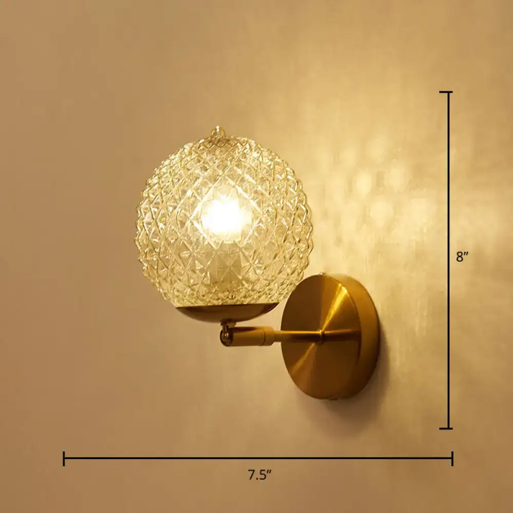 Postmodern gold ball shaped wall sconce with textured glass shade bedroom light