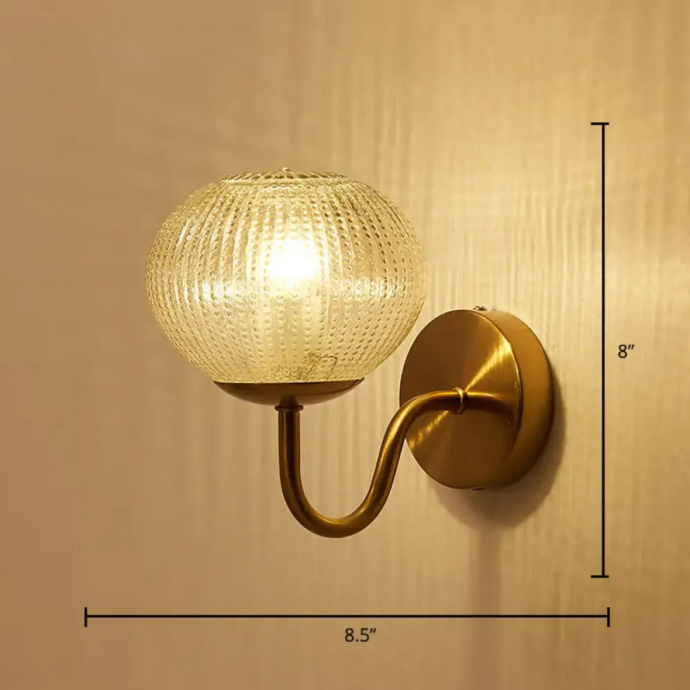 Postmodern gold ball shaped wall sconce with textured glass shade bedroom light