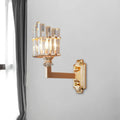 Postmodern gold single wall light with clear faceted crystal rods in an upward-facing fan pattern wall mounted lamp
