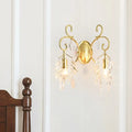 Postmodern gold curve arm sconce light with ornate curved arms and crystal teardrop accents for living room