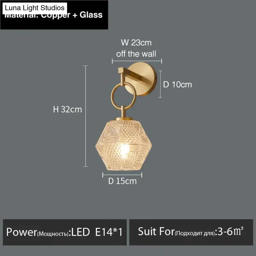 A hexagonal glass pendant luxury led wall lamp with copper finish and faceted design for postmodern luxury bedroom
