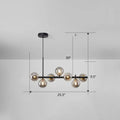 Black metal DecorBites™ LED island pendant light with seven smoke grey cognac glass globes for dining room