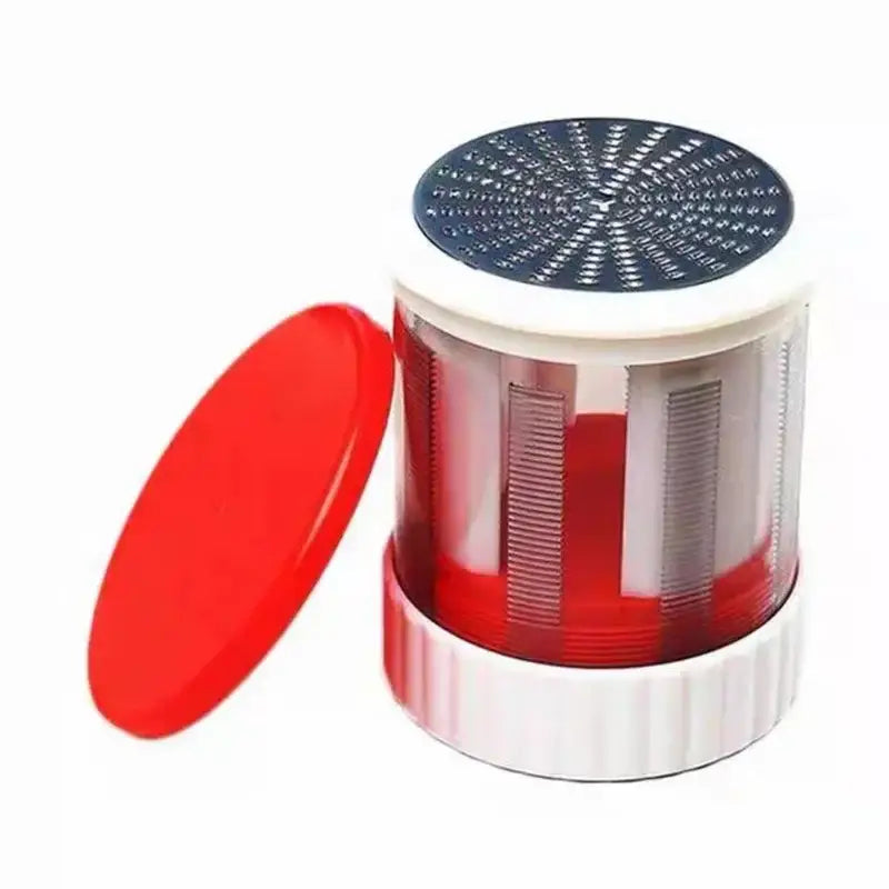 Red and white manual citrus juicer kitchen tool with measuring cup