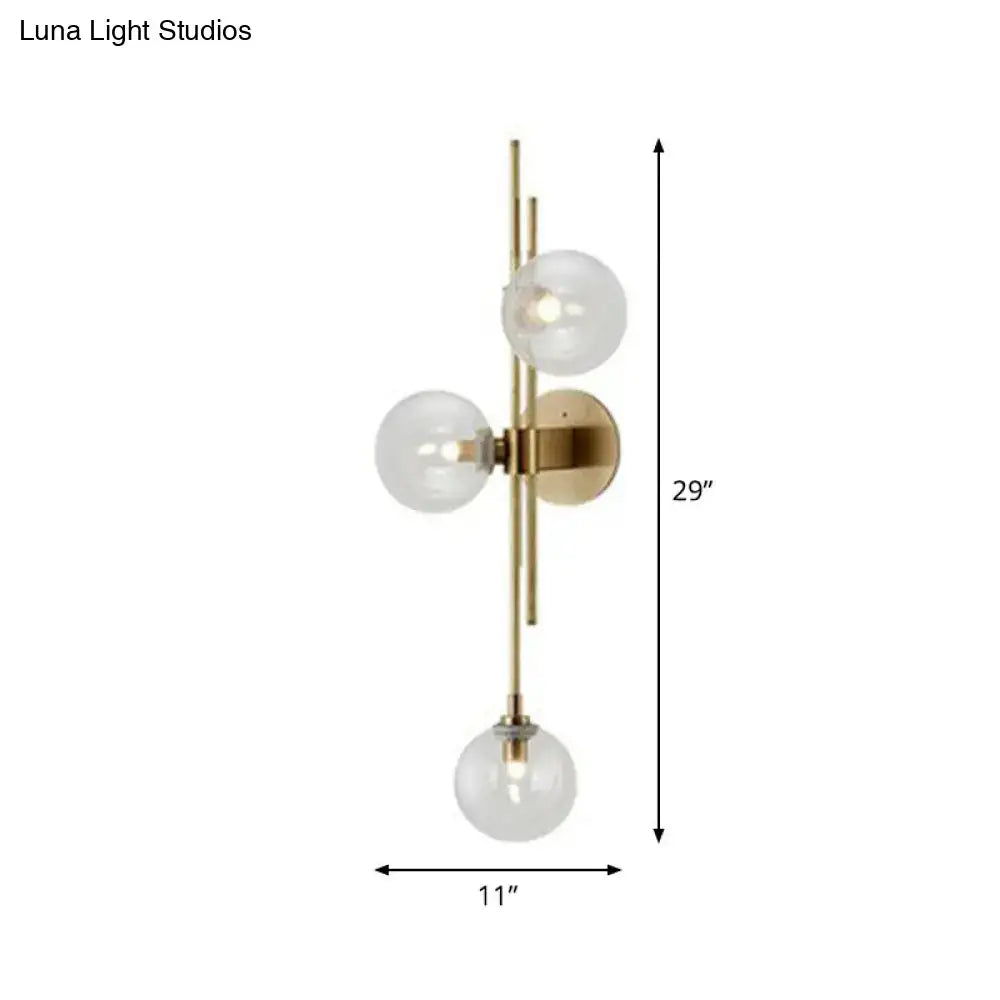 Retro brass wall sconce with 3 glass globes for dining room
