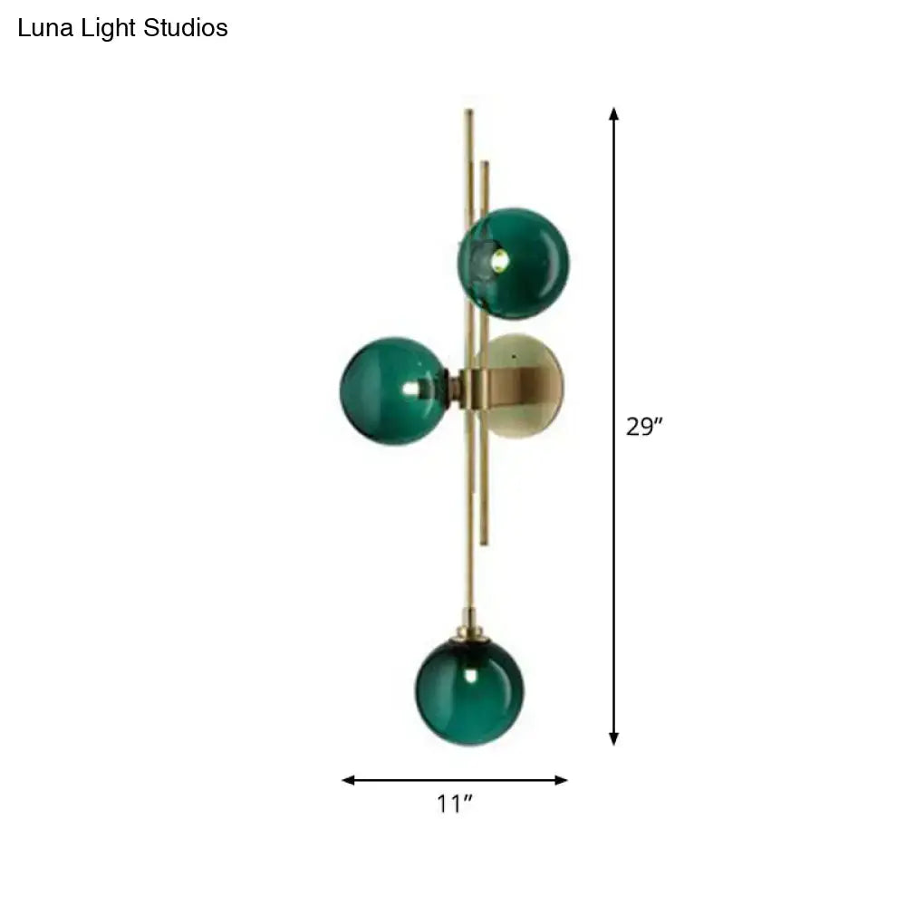 Retro brass wall sconce with 3 glass globes for dining room