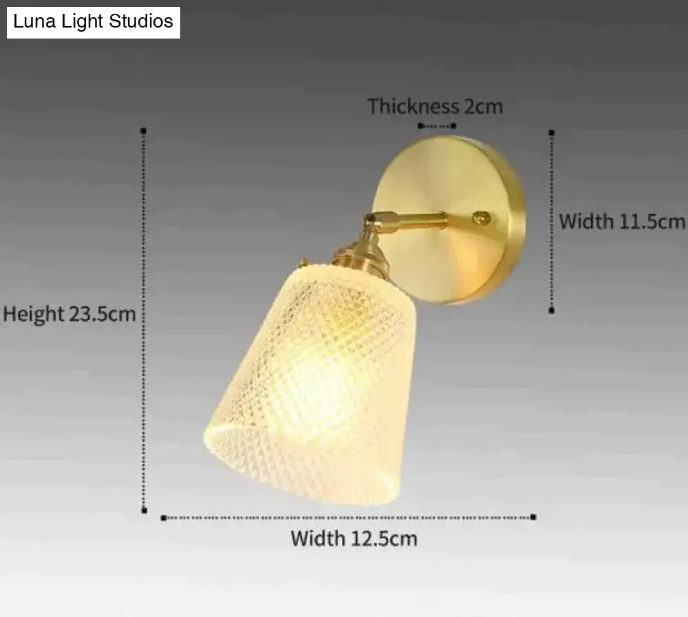 Gold-toned retro copper flower brass wall sconce with textured translucent off-white fluted glass shade for bedroom use