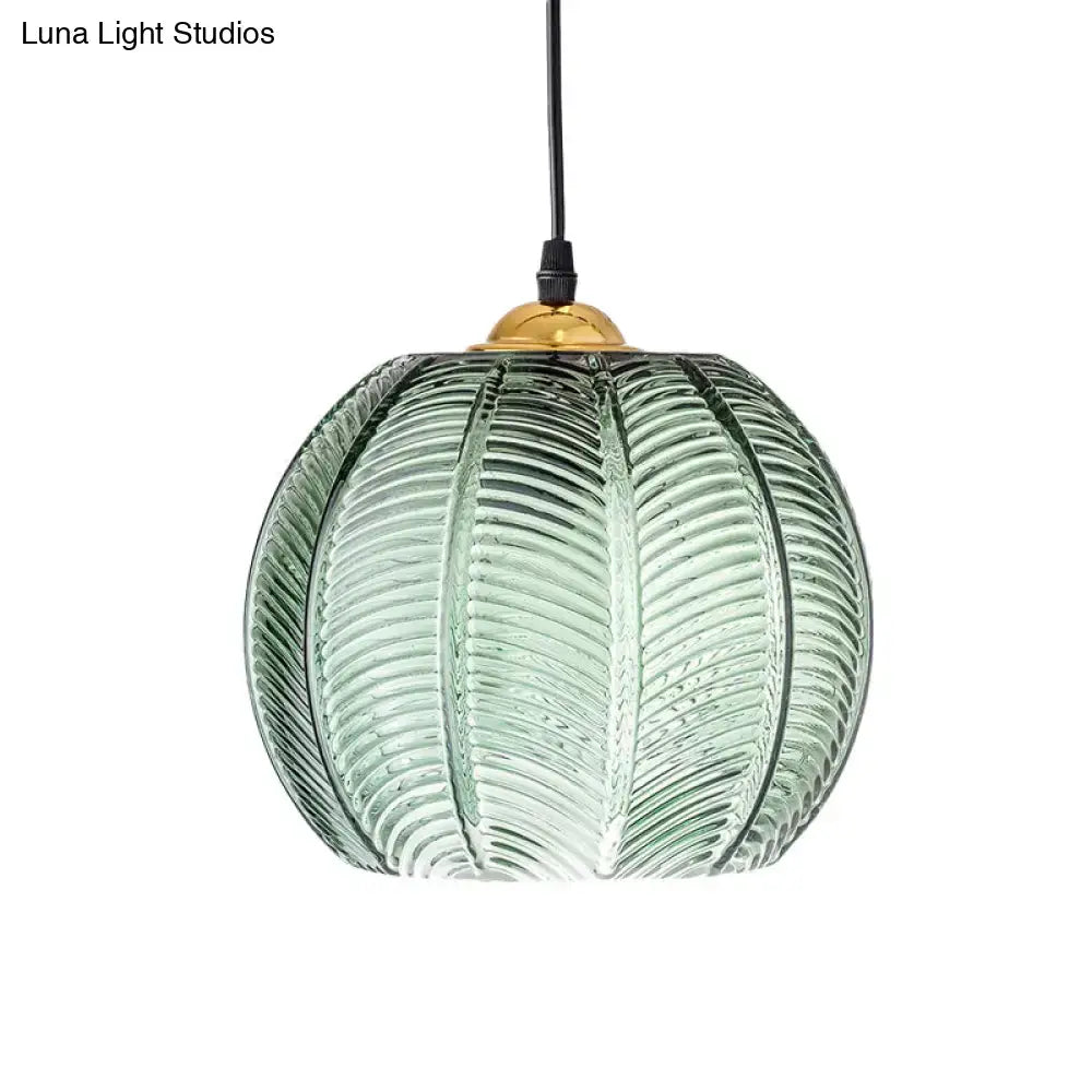 Retro green ribbed glass pumpkin dinette pendant lamp with textured leaf pattern and brass fixture for dining room lighting