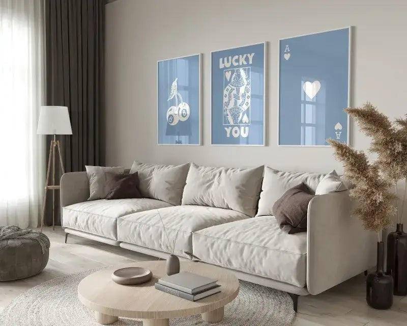 Beige upholstered sectional sofa with dark brown accent pillows complementing decorbites retro wall art posters set