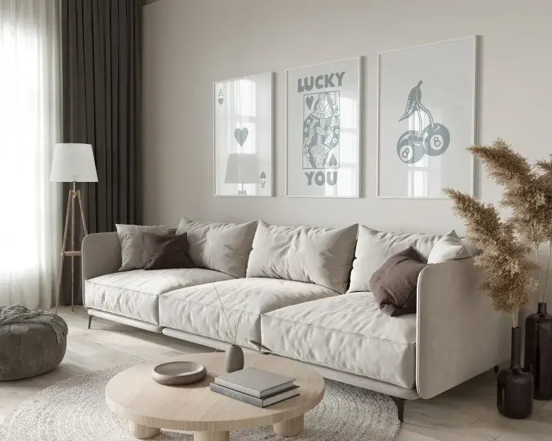 Beige upholstered sectional sofa with rounded armrests and modern design paired with decorbites retro wall art posters set queen of hearts theme