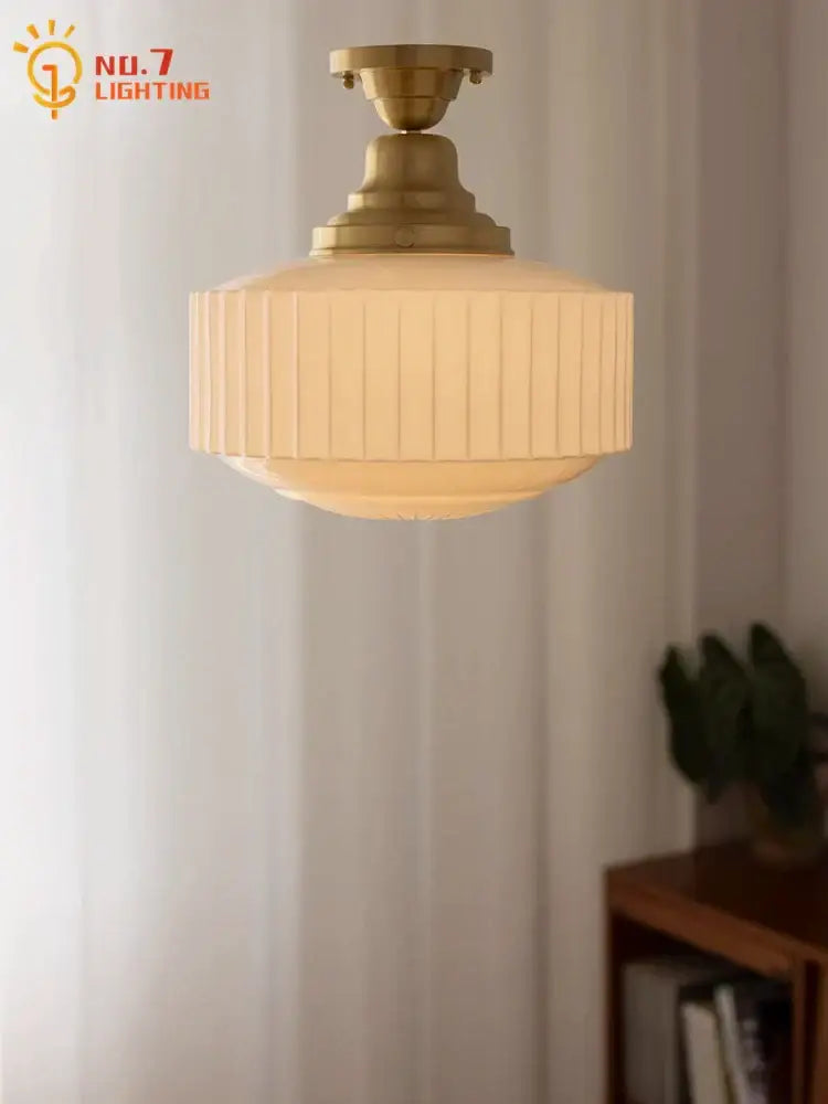 Ribbed cream glass and brass pendant light for dining room