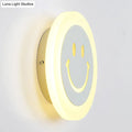 Round led smiley wall sconce with warm white light featuring a gray center and yellow eyes for bedroom decor