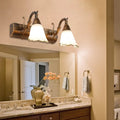Rustic distressed white glass wall light with bronze metal arms and warm-toned shades for bathroom vanity 110v-120v