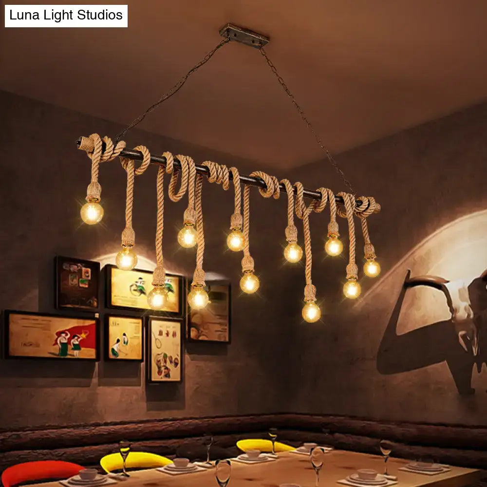 Rustic industrial pendant light with dark metal frame and wood hemp rope suspending exposed bulb pendant ideal for restaurants