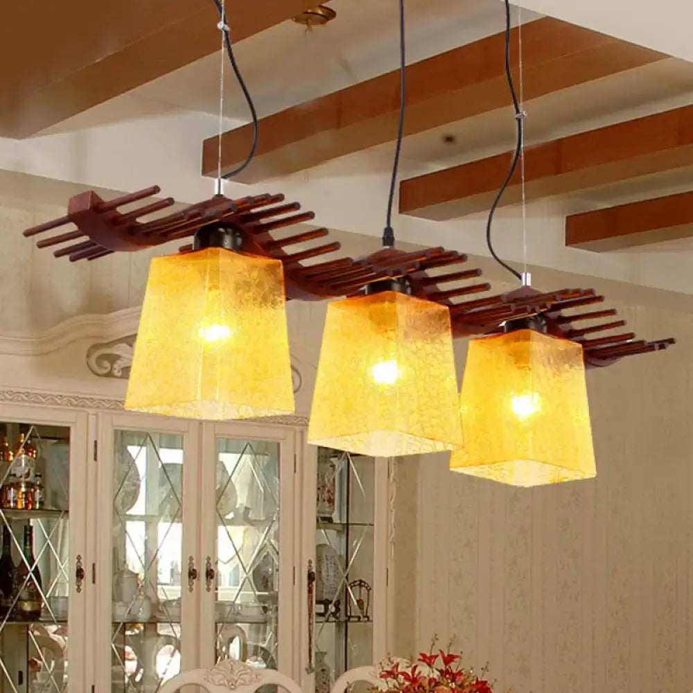Rustic wood dining room pendant with yellow crackle glass shades