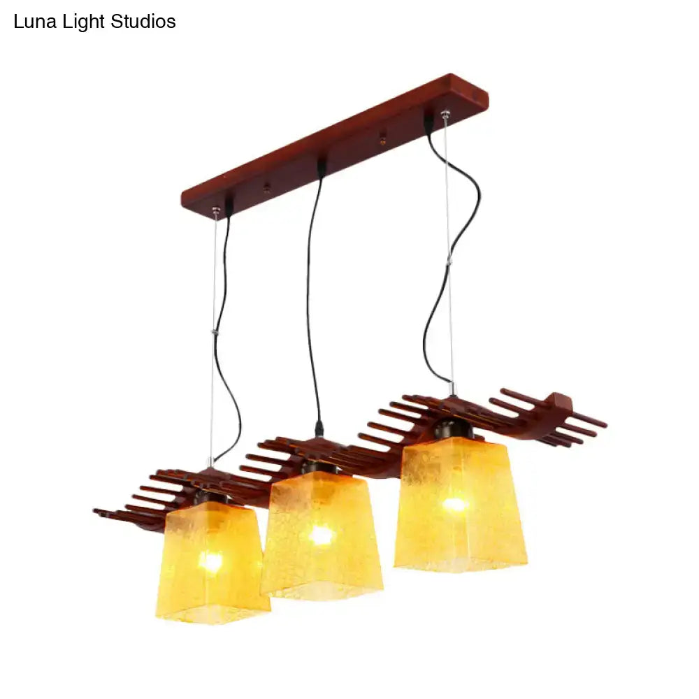 Rustic wood dining room pendant with yellow crackle glass shades