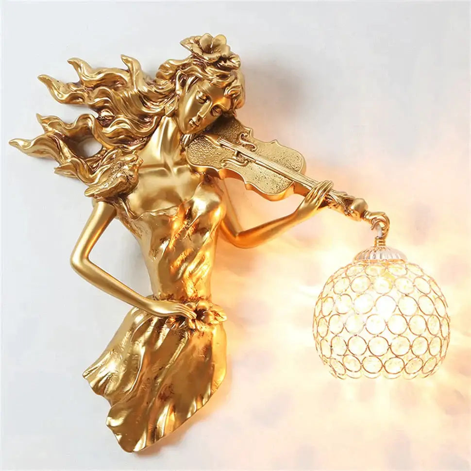Sculptural gold violinist crystal wall lamp with ornate globe shade featuring a flowing hair woman wall sconce