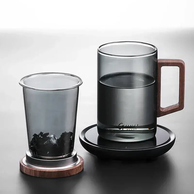 Sleek dark gray double walled glass tea cup with wooden lid kitchen