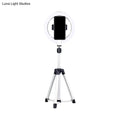Sleek silver and white circular fill-in lamp with a white ring light mounted on a silver tripod and black phone clamp