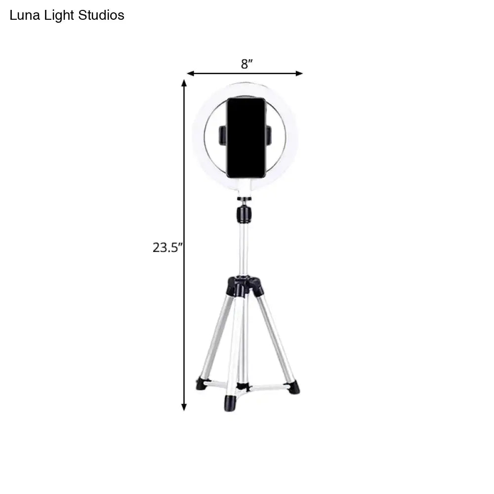 Sleek silver and white circular fill-in lamp bedroom phone holder