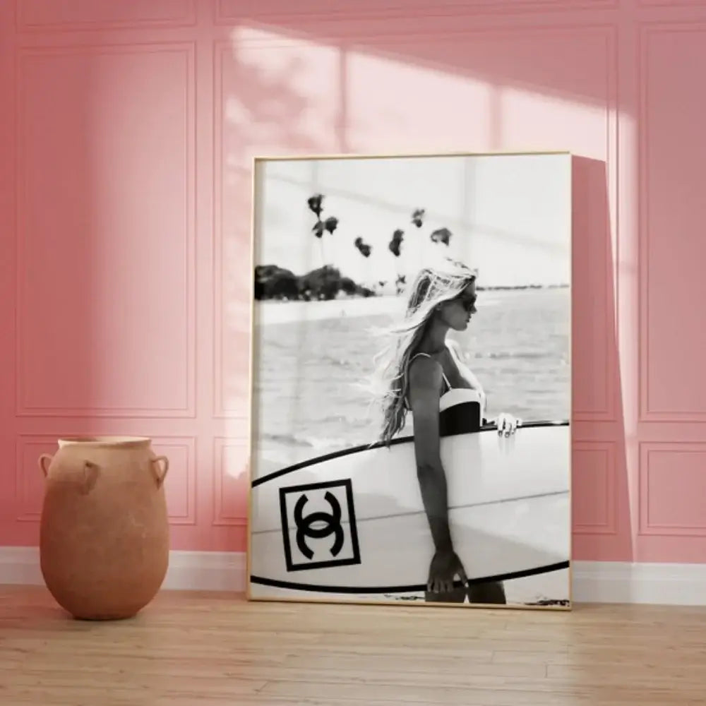 Black and white surfboard wall art poster featuring a long-haired surfer holding a Chanel logo surfboard for teen decor