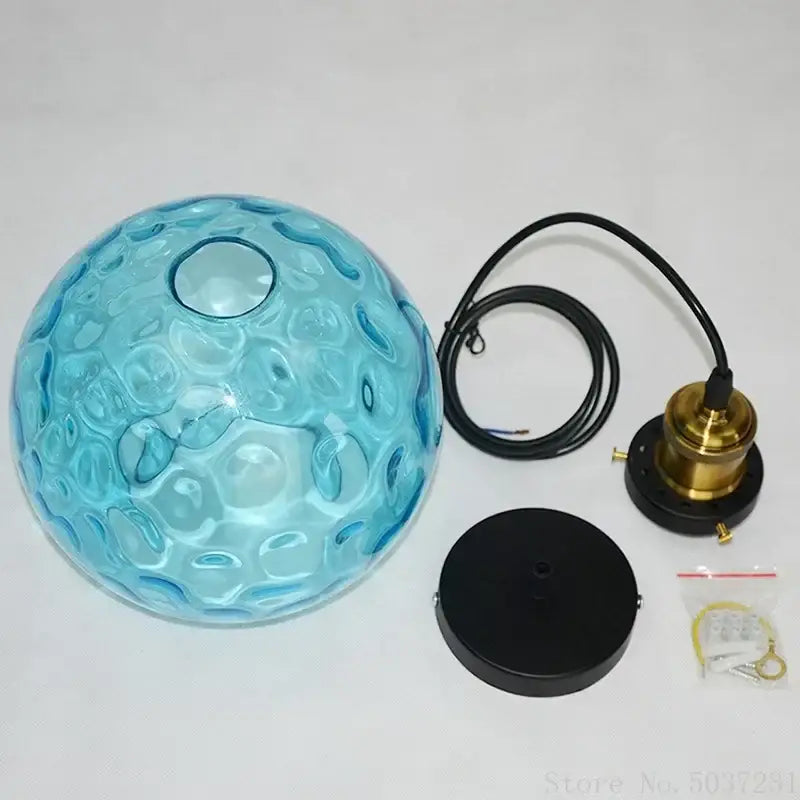 Textured blue glass ball pendant light for dining room