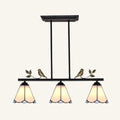 Black metal tiffany style island ceiling light with three stained glass shades amber blue and bird decor chain cord length adjustable