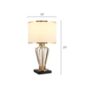 Gold-toned decorbites traditional single brass table light with cream drum shade on black pedestal e26 e27 110v-120v